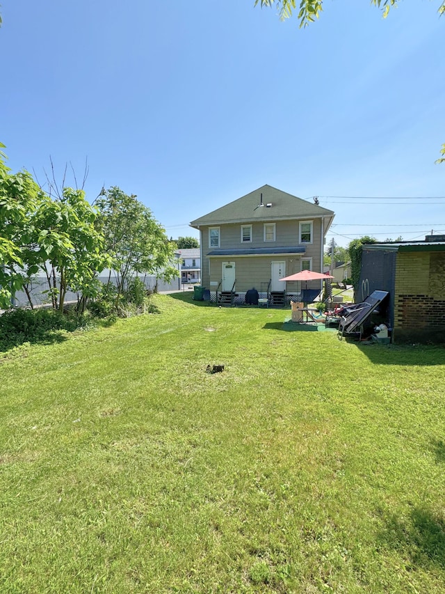373-375 N Courtland St, East Stroudsburg, PA 18301 - back of property featuring a yard and entry steps