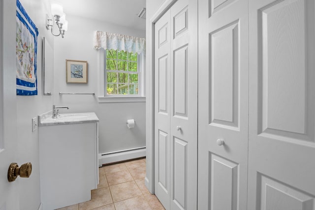 450 Bear Creek Lake Dr, Jim Thorpe, PA 18229 - bathroom with baseboard heating, a closet, vanity, and tile patterned floors