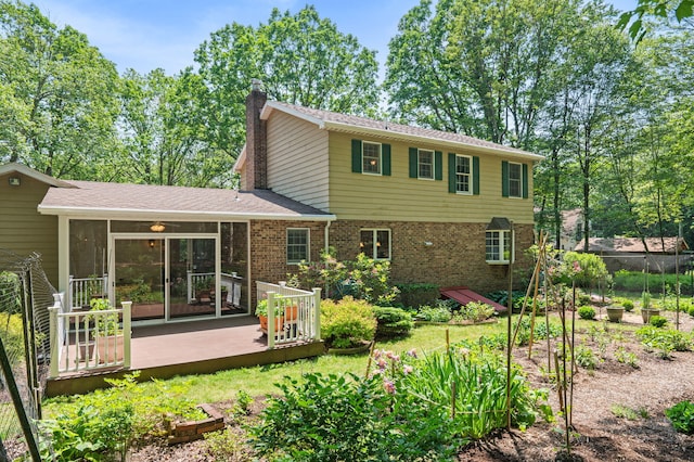 450 Bear Creek Lake Dr, Jim Thorpe, PA 18229 - rear view of house featuring a vegetable garden, a chimney, a sunroom, and brick siding