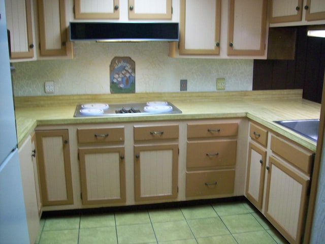 2112 Yorkshire Ct, Bushkill, PA 18324 - kitchen with ventilation hood, stovetop, light countertops, light tile patterned flooring, and decorative backsplash