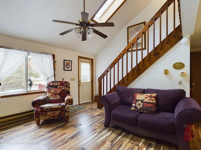 living room featuring lofted ceiling, stairs, a ceiling fan, and wood finished floors