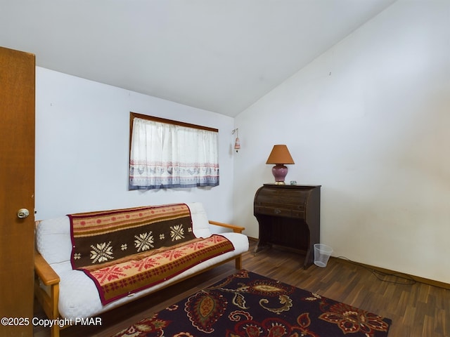 sitting room featuring vaulted ceiling and wood finished floors