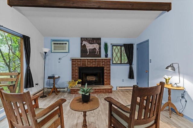 130 Deer Trail Dr, Saylorsburg, PA 18353 - living room with wood finished floors, a wall unit AC, and a fireplace