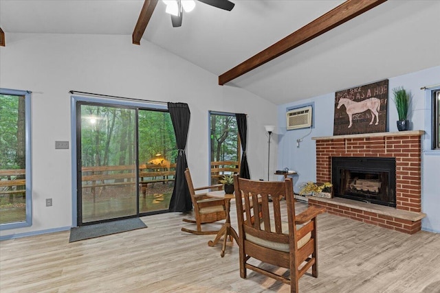130 Deer Trail Dr, Saylorsburg, PA 18353 - living room featuring wood finished floors, a brick fireplace, a ceiling fan, and a wall mounted air conditioner