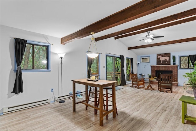 130 Deer Trail Dr, Saylorsburg, PA 18353 - dining area featuring a baseboard radiator, light wood-style flooring, a fireplace, and a ceiling fan