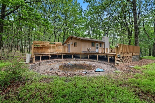 130 Deer Trail Dr, Saylorsburg, PA 18353 - back of house with a wooden deck and a chimney