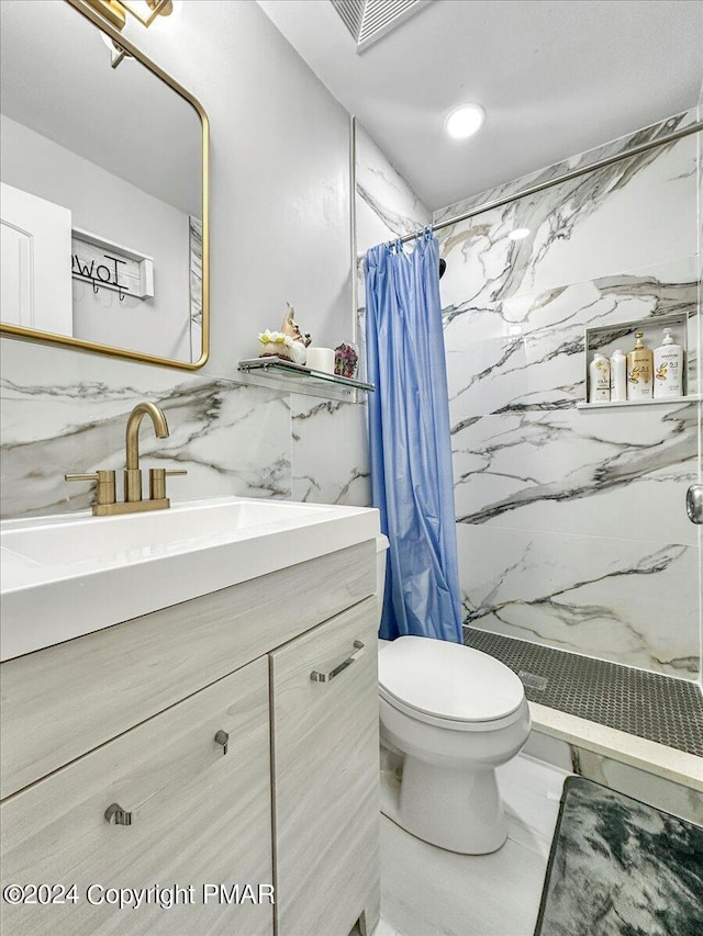 full bath featuring a stall shower, visible vents, toilet, marble finish floor, and vanity