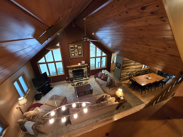 140 Boones Trl, Pocono Pines, PA 18350 - living area with a stone fireplace, a ceiling fan, and wood ceiling
