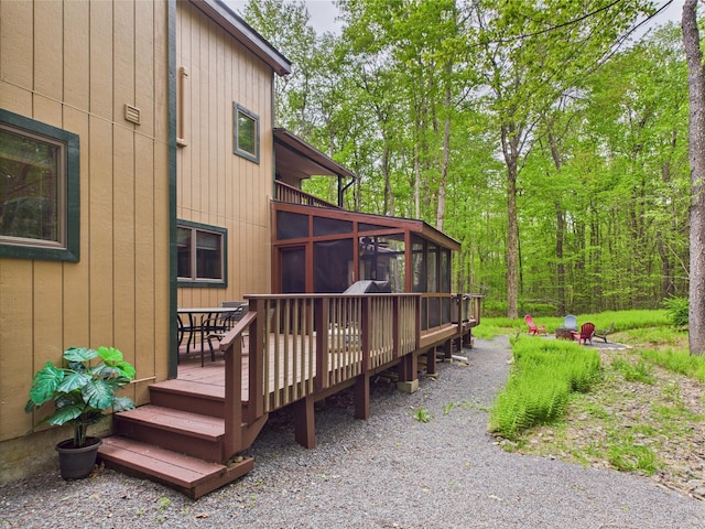140 Boones Trl, Pocono Pines, PA 18350 - back of house with a sunroom and a wooden deck