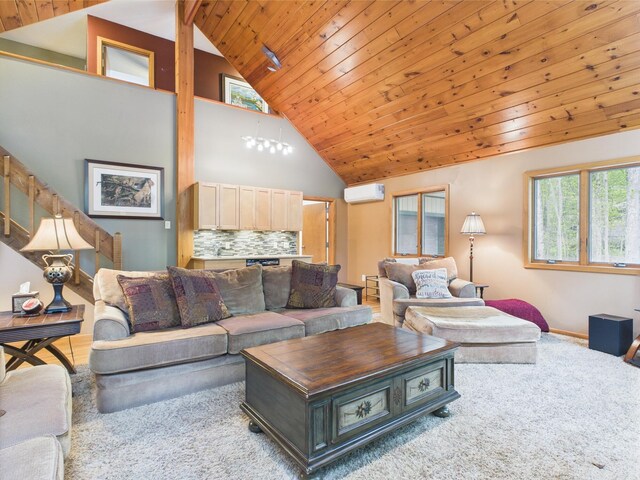 140 Boones Trl, Pocono Pines, PA 18350 - carpeted living room featuring a wall mounted AC, wood ceiling, high vaulted ceiling, and baseboards