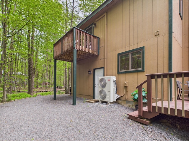 140 Boones Trl, Pocono Pines, PA 18350 - back of property featuring a balcony, a wooden deck, and ac unit