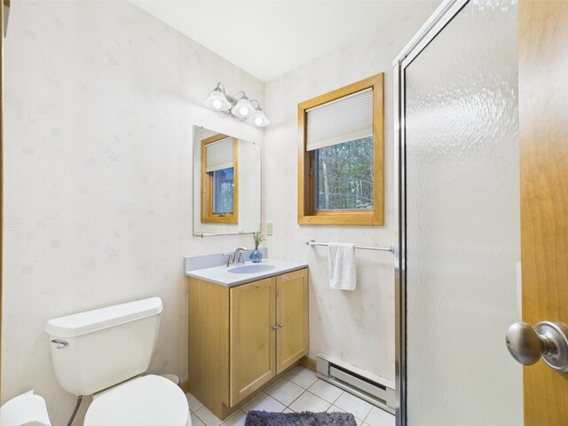 140 Boones Trl, Pocono Pines, PA 18350 - full bath with baseboard heating, tile patterned floors, toilet, vanity, and a shower with shower door