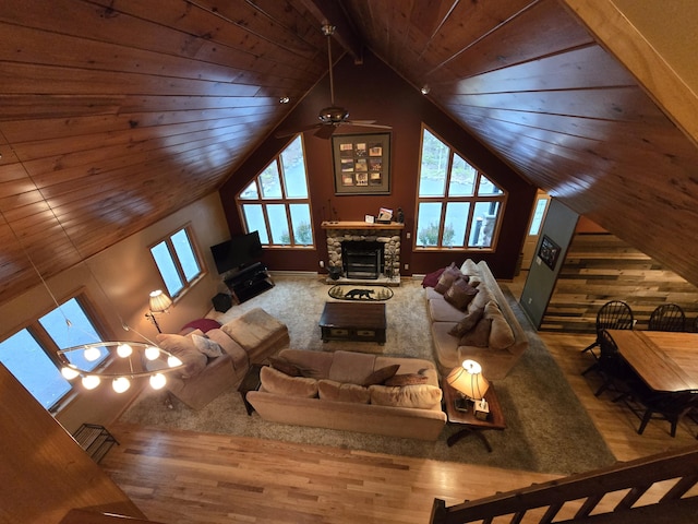 140 Boones Trl, Pocono Pines, PA 18350 - living room featuring wood finished floors, a ceiling fan, a stone fireplace, and wood ceiling