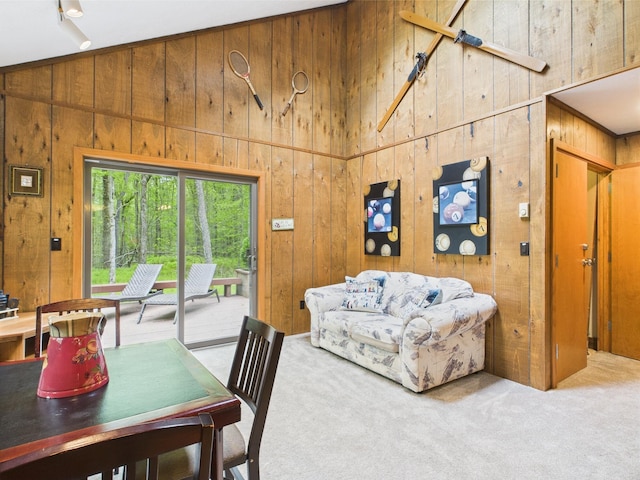 140 Boones Trl, Pocono Pines, PA 18350 - carpeted dining space featuring wooden walls and a high ceiling