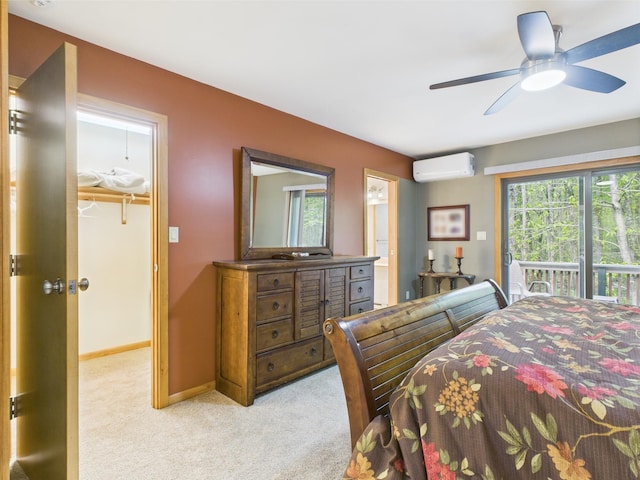 140 Boones Trl, Pocono Pines, PA 18350 - bedroom featuring a wall mounted AC, light carpet, a walk in closet, access to outside, and baseboards