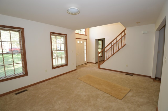 141 Fergus Way, Tobyhanna, PA 18466 - entrance foyer with carpet floors, healthy amount of natural light, and stairway