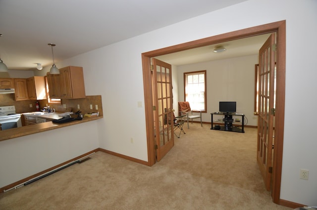 141 Fergus Way, Tobyhanna, PA 18466 - kitchen with white electric range, french doors, light carpet, and tasteful backsplash