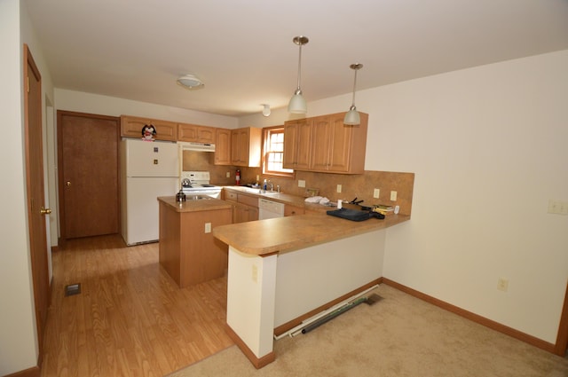 141 Fergus Way, Tobyhanna, PA 18466 - kitchen with white appliances, a kitchen island, under cabinet range hood, a peninsula, and decorative light fixtures