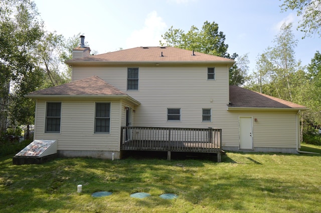 141 Fergus Way, Tobyhanna, PA 18466 - back of house with a deck, a lawn, a chimney, and roof with shingles