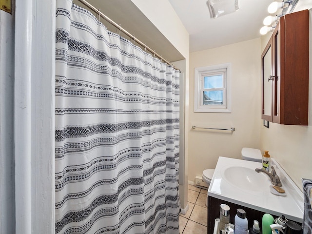 210 N Schanck Ave, Pen Argyl, PA 18072 - bathroom featuring vanity, toilet, tile patterned floors, and a shower with curtain