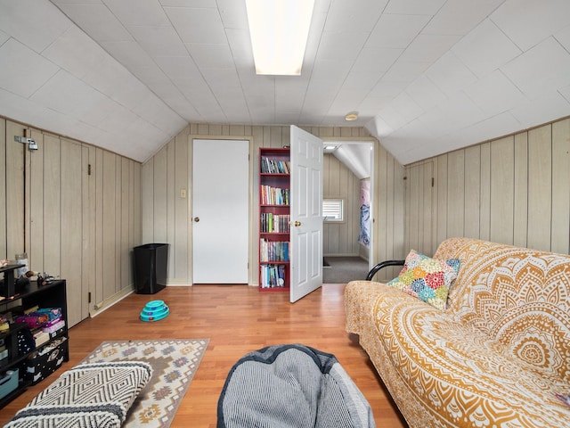 210 N Schanck Ave, Pen Argyl, PA 18072 - living area with vaulted ceiling, wood walls, and wood finished floors