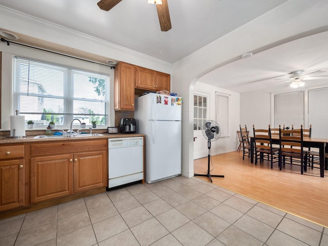 210 N Schanck Ave, Pen Argyl, PA 18072 - kitchen featuring white appliances, a ceiling fan, arched walkways, a sink, and light tile patterned floors