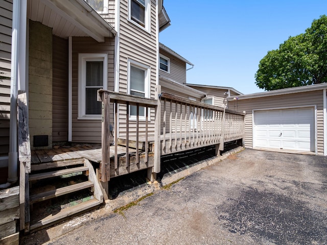 210 N Schanck Ave, Pen Argyl, PA 18072 - view of property exterior featuring a wooden deck, a garage, and driveway