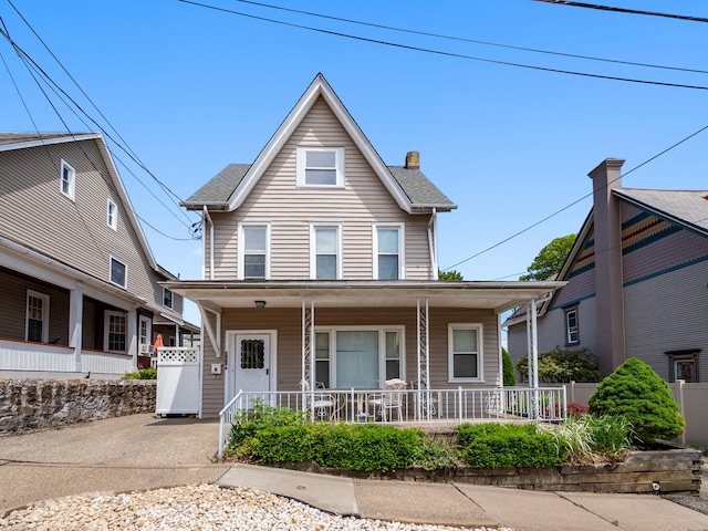 210 N Schanck Ave, Pen Argyl, PA 18072 - view of front of house featuring covered porch and a chimney