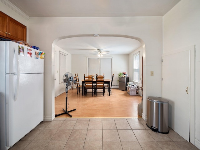 210 N Schanck Ave, Pen Argyl, PA 18072 - dining space featuring arched walkways, a ceiling fan, and light tile patterned floors