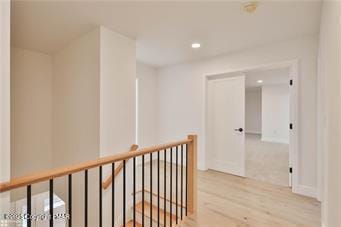 corridor with recessed lighting and wood finished floors