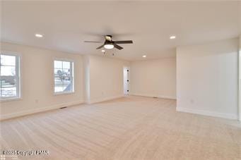 empty room with recessed lighting, a ceiling fan, and baseboards