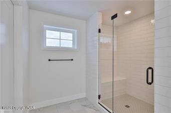 full bath with a stall shower, baseboards, and recessed lighting