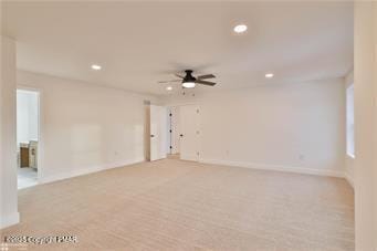 unfurnished room with recessed lighting, light carpet, ceiling fan, and baseboards