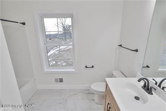 bathroom featuring baseboards, vanity, and toilet