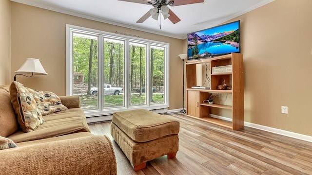 235 White Pine Ln, Pocono Lake, PA 18347 - sitting room featuring ornamental molding, ceiling fan, light wood-style flooring, a baseboard heating unit, and baseboards