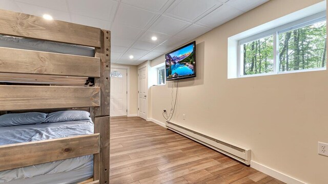 235 White Pine Ln, Pocono Lake, PA 18347 - bedroom with baseboard heating, recessed lighting, wood finished floors, and baseboards