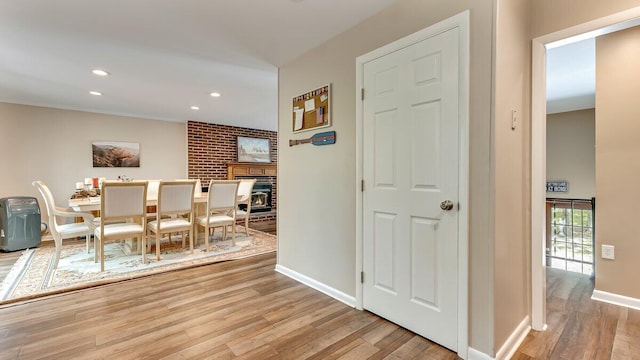 235 White Pine Ln, Pocono Lake, PA 18347 - dining space featuring light wood-style flooring, baseboards, recessed lighting, and a fireplace