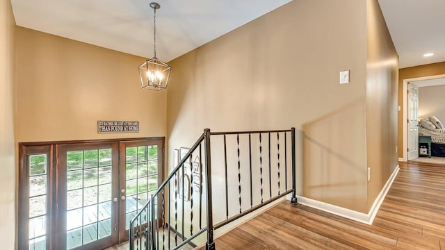 235 White Pine Ln, Pocono Lake, PA 18347 - foyer featuring baseboards, wood finished floors, a chandelier, recessed lighting, and french doors