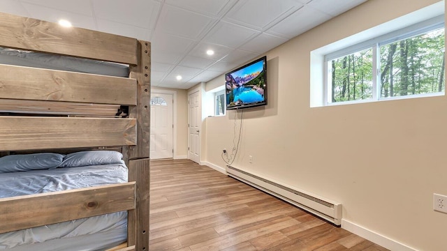 235 White Pine Ln, Pocono Lake, PA 18347 - bedroom with baseboard heating, recessed lighting, wood finished floors, and baseboards