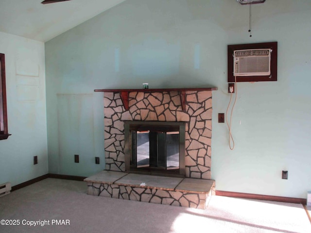 interior details featuring a wall mounted AC, a fireplace, carpet flooring, and baseboards