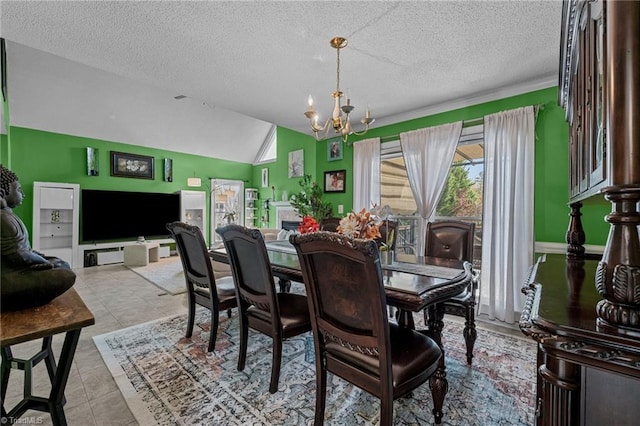 dining space with lofted ceiling, light tile patterned floors, a textured ceiling, and a notable chandelier