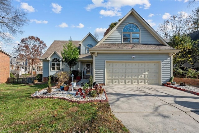 view of front of property with a shingled roof, a front yard, driveway, and fence