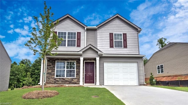 view of front facade featuring a garage and a front lawn