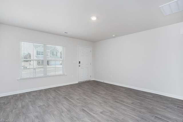 empty room featuring hardwood / wood-style floors