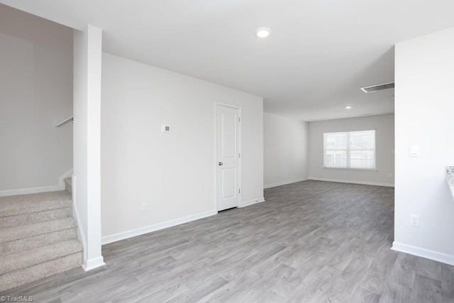 spare room with light hardwood / wood-style flooring