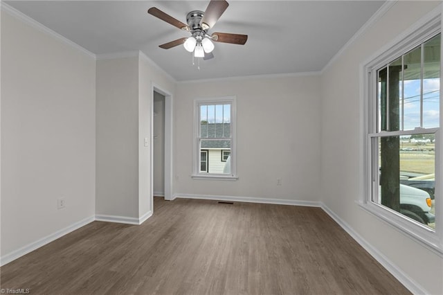 spare room featuring ornamental molding, dark hardwood / wood-style floors, and ceiling fan