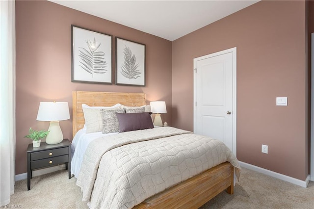 bedroom with carpet and baseboards
