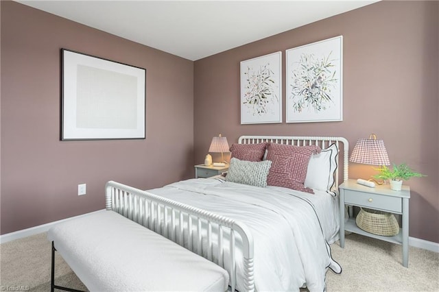 carpeted bedroom with baseboards