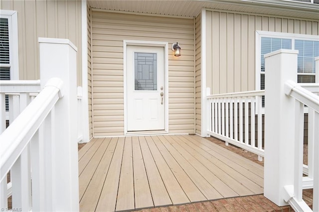 entrance to property featuring a wooden deck