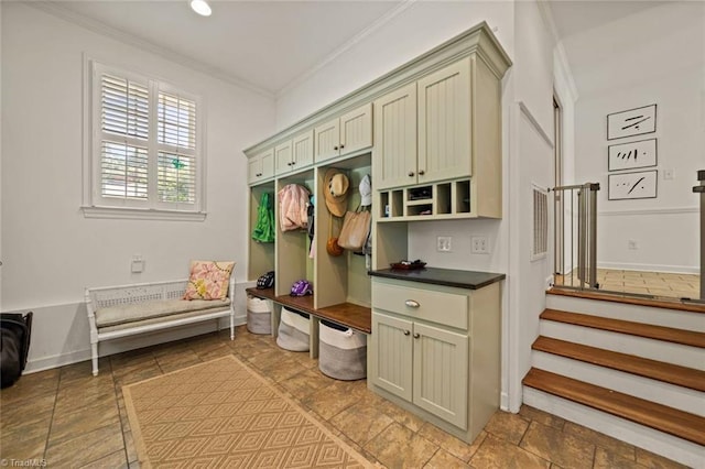 948 Kenleigh Cir, Winston-Salem, NC 27106 - mudroom with ornamental molding, built in desk, and light stone finish floors